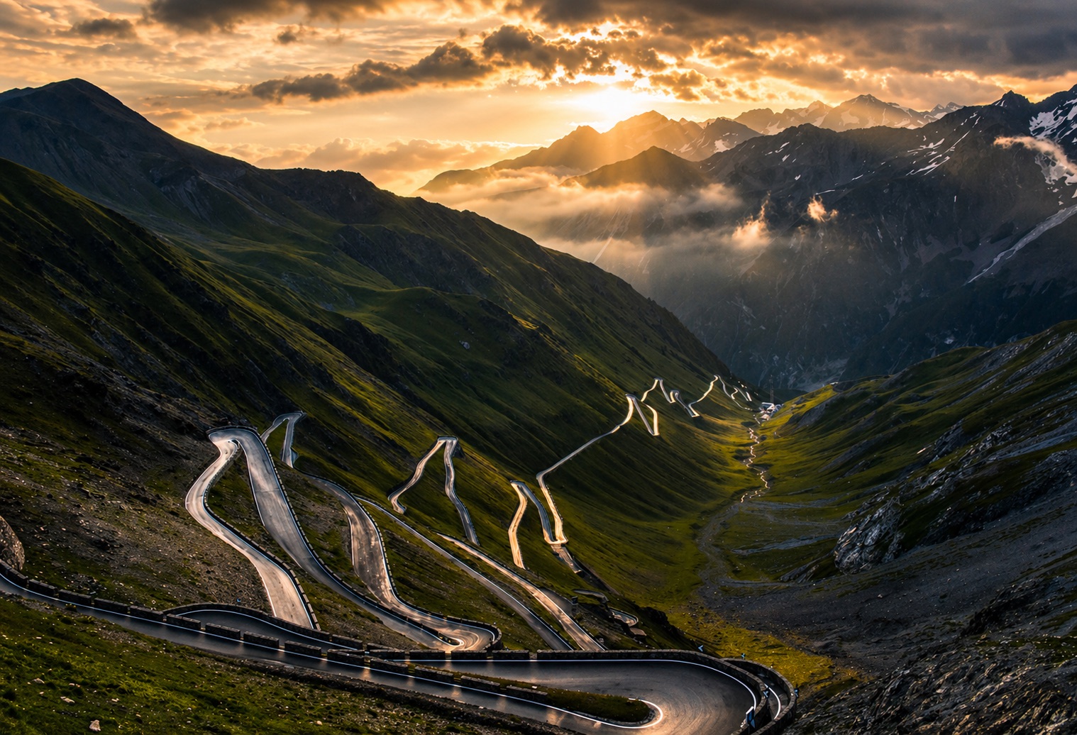 Stelvio Pass mountain road at sunset